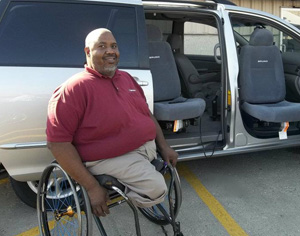 Cincinnati MobilityWorks General Manager Jeff Witt assists with wheelchair vans